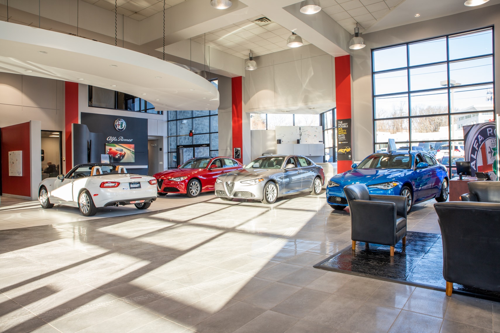 Modern dealership showroom floor with cars on display